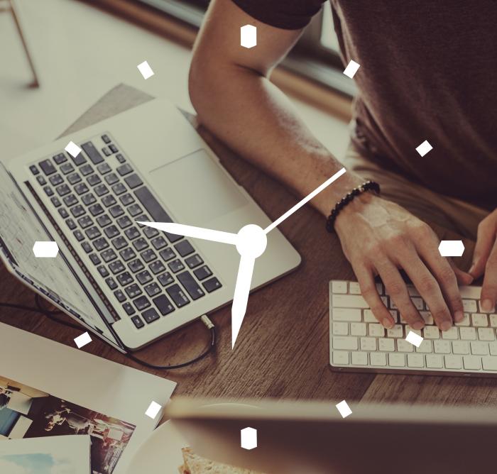 Clock overlay on image of a man typing 