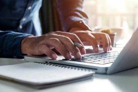 Close up image of someone typing